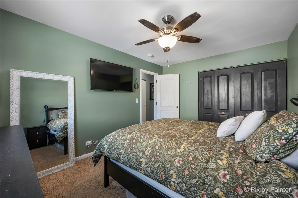 320 Homestead Drive Bolingbrook, IL 60440 - Photo 16 of 33 a bedroom with a large bed and a flat screen tv