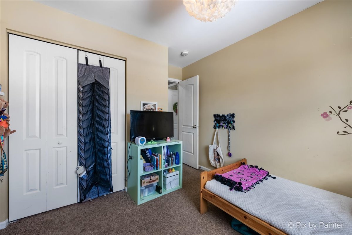 320 Homestead Drive Bolingbrook, IL 60440 - Photo 20 of 33 a bedroom with a bed and a window