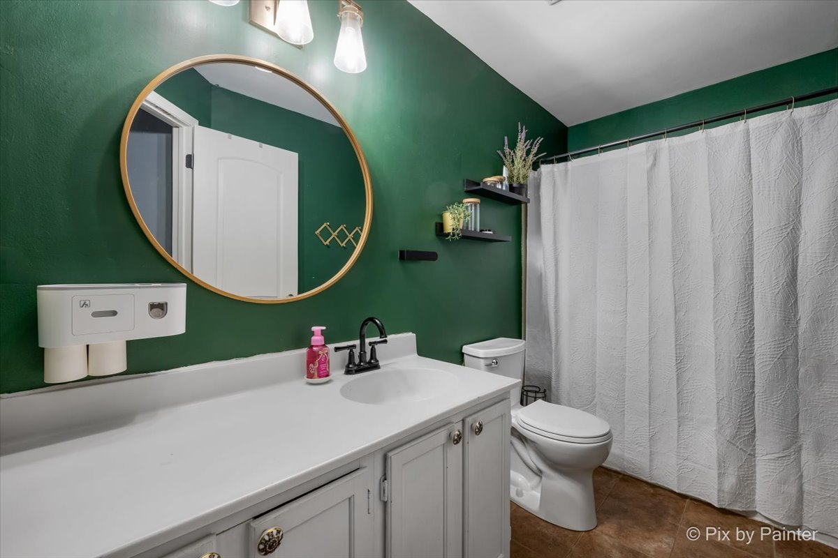 320 Homestead Drive Bolingbrook, IL 60440 - Photo 21 of 33 a bathroom with a sink mirror and toilet