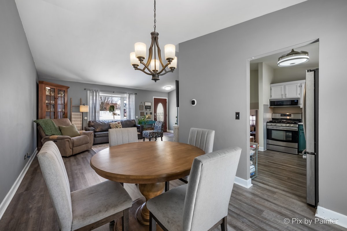 320 Homestead Drive Bolingbrook, IL 60440 - Photo 5 of 33 a view of a dining room with furniture window and wooden floor