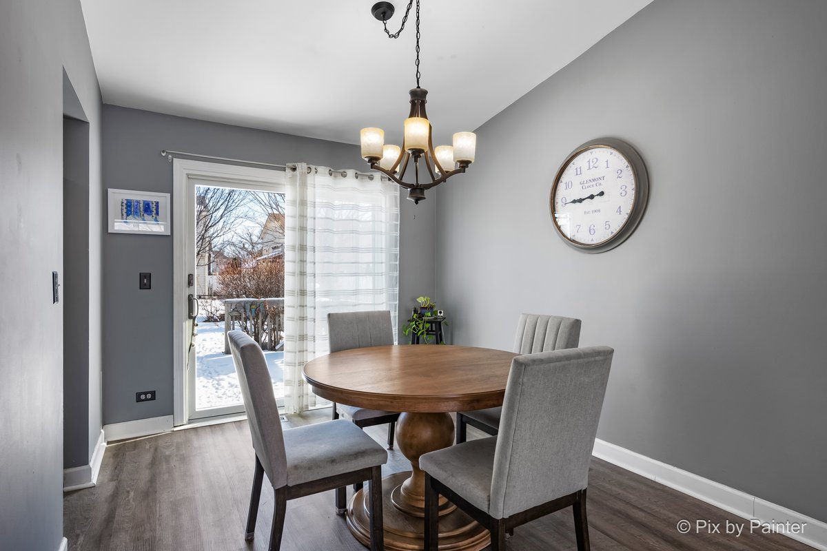 320 Homestead Drive Bolingbrook, IL 60440 - Photo 6 of 33 a view of a dining room with furniture window and wooden floor