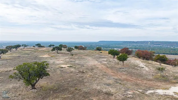 an aerial view of house with yard
