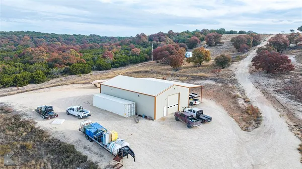 an aerial view of a house with outdoor space