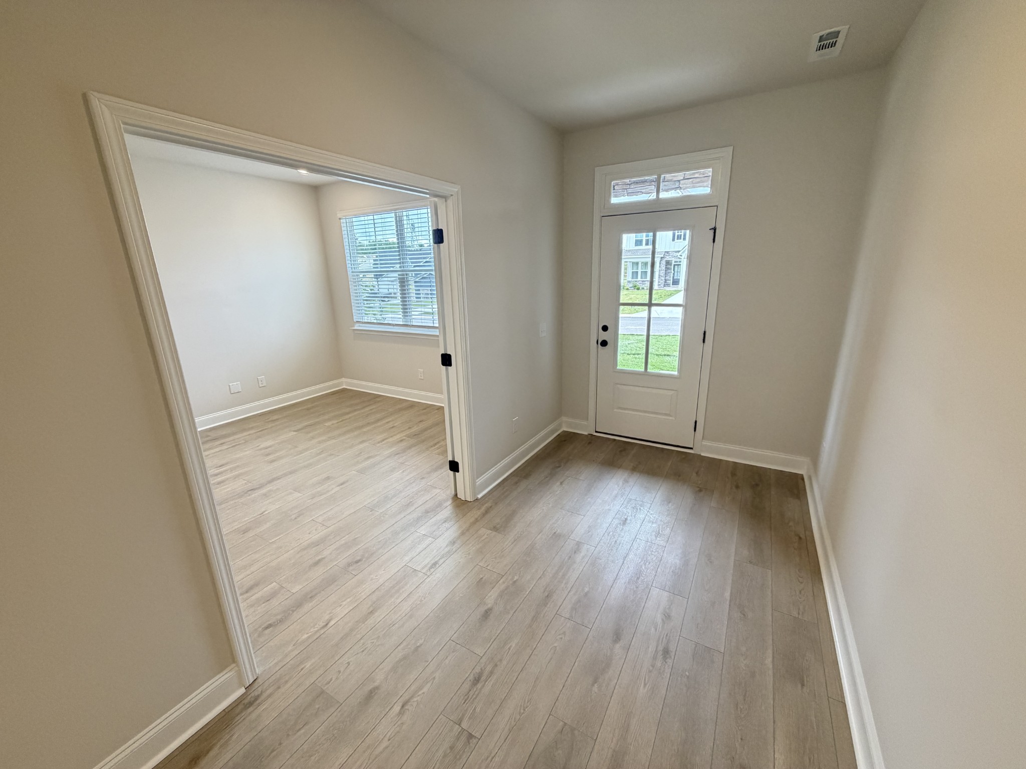 147 Emeline Way Mount Juliet, TN 37122 - Photo 5 of 41 an empty room with wooden floor and windows