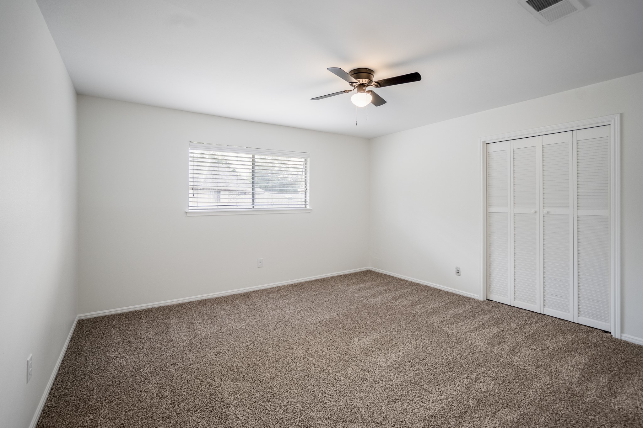 8006 Vickridge Lane Spring, TX 77379 - Photo 28 of 50 One of four upstairs bedrooms, this space features fresh paint, soft new carpet, and natural light—offering a comfortable room with plenty of flexibility.