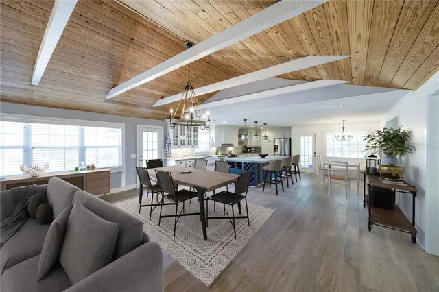 a kitchen with stainless steel appliances a refrigerator sink and cabinets