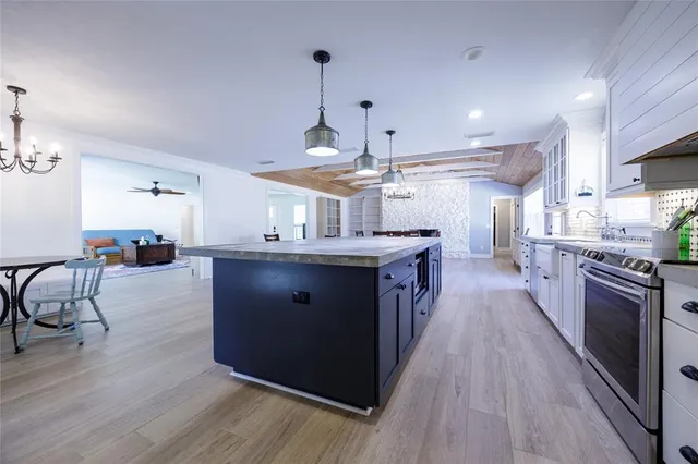 a view of empty room with wooden floor and fireplace