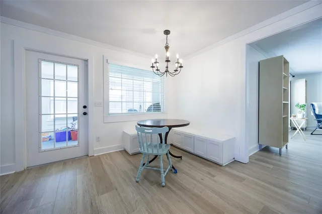 a view of livingroom with hardwood floor and workspace