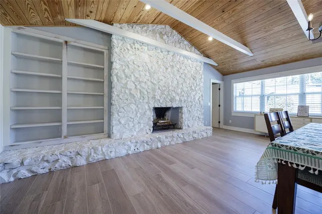 a spacious bedroom with a bed closet and a large window