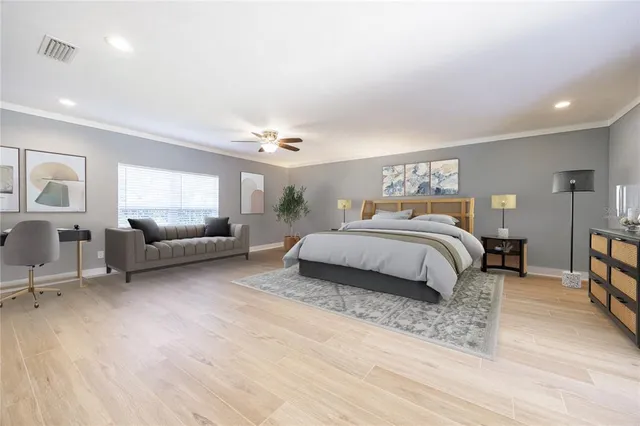a spacious bathroom with a granite countertop sink a mirror and a shower