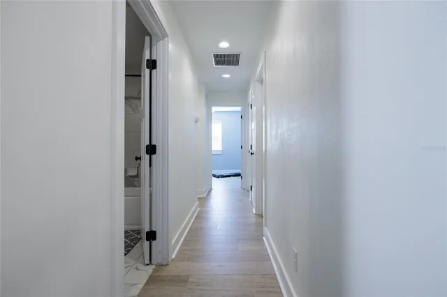 a bedroom with a bed and a table