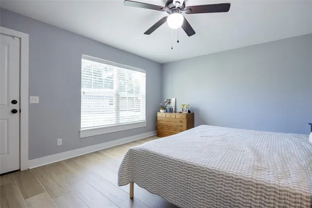 a bathroom with a sink toilet a mirror a bathtub and shower