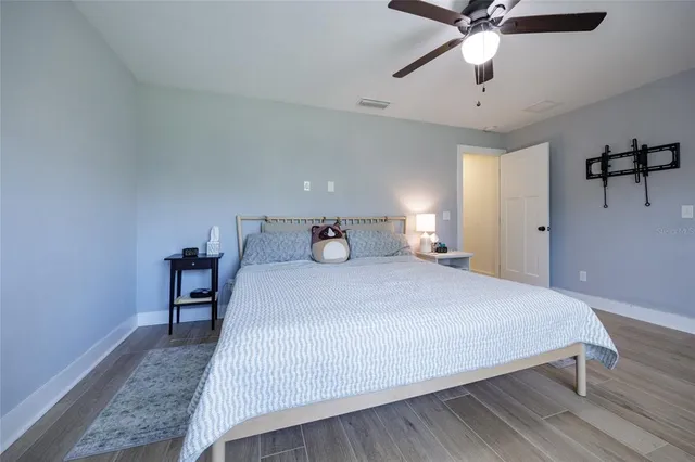 a view of workspace with wooden floor windows