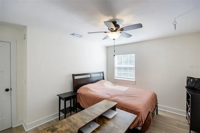 a view of a backyard with a garden and entertaining space