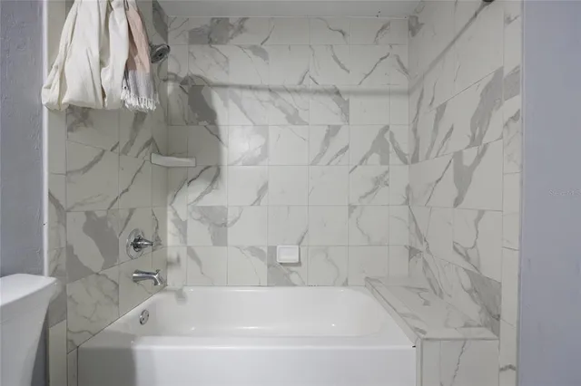 a view of a backyard with large trees