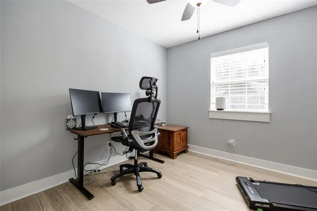 an aerial view of a house with a garden and lake view