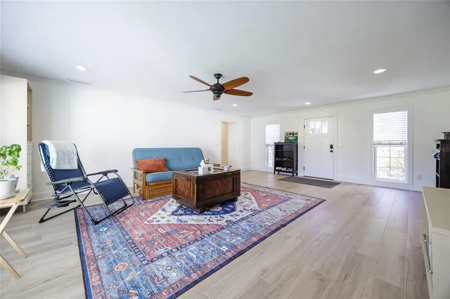 a dining room with furniture and wooden floor