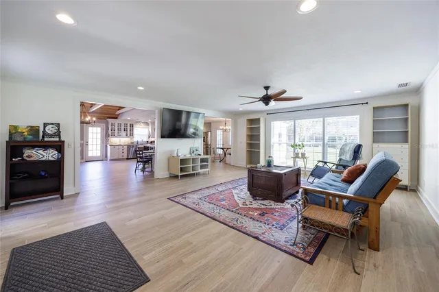 a dining room with furniture window and wooden floor