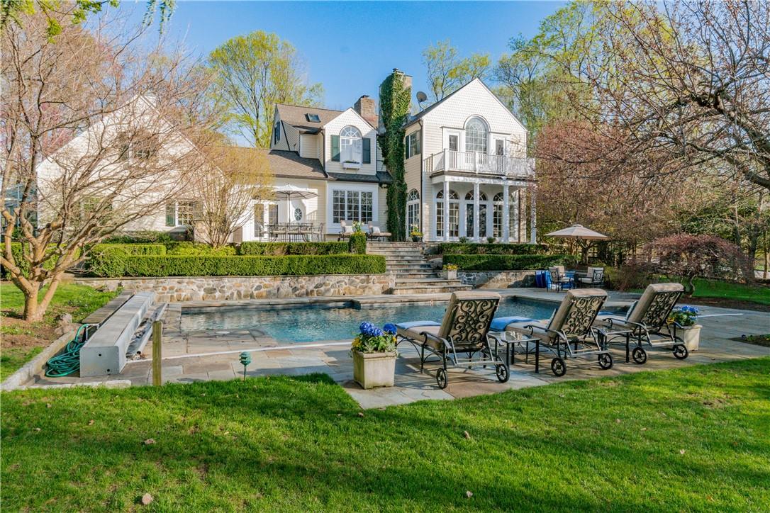 60 Devoe Road Chappaqua, NY 10514 - Photo 1 of 1 a front view of a house with garden and sitting area