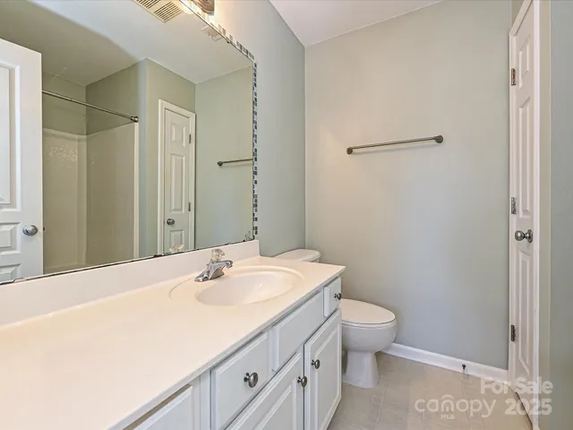 a bathroom with a sink toilet and vanity