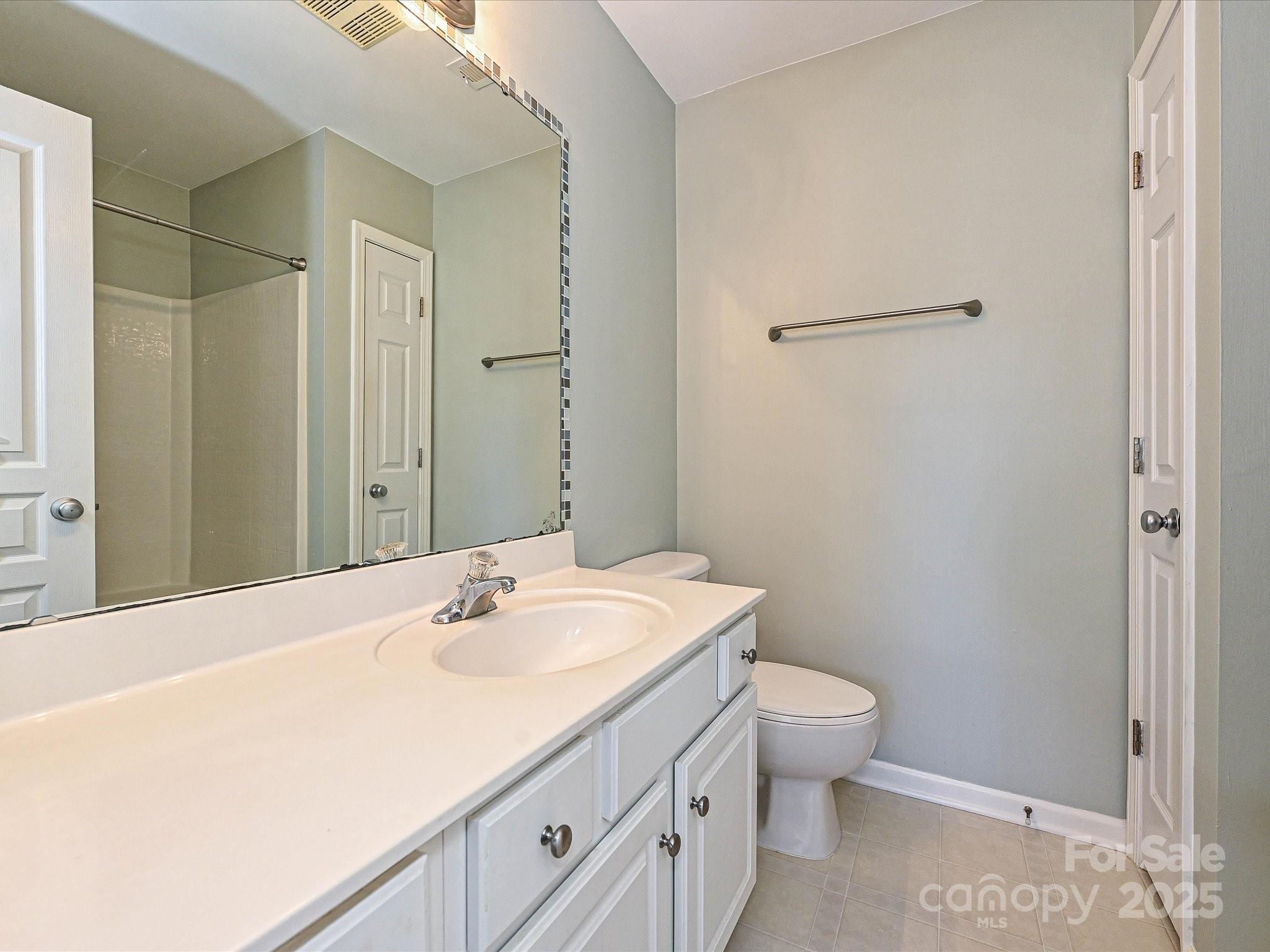 1115 Drummond Lane Matthews, NC 28104 - Photo 16 of 24 a bathroom with a sink toilet and vanity