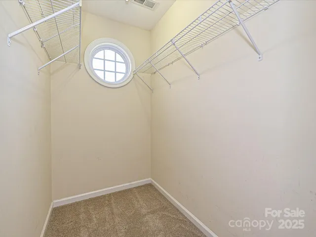 a view of small space with racks on the wall