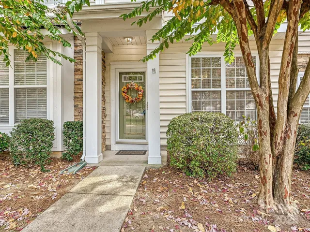 a view of a house with a tree