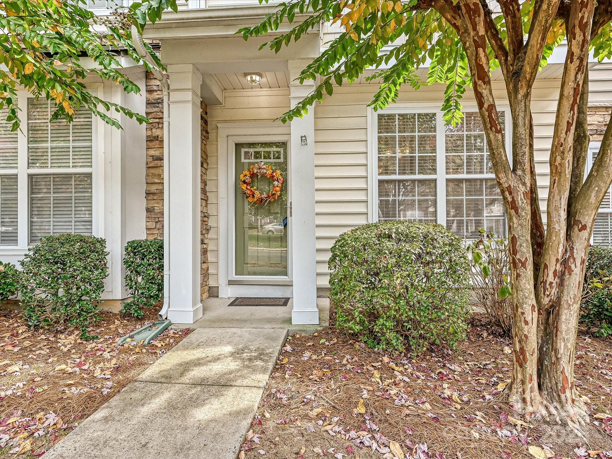 1115 Drummond Lane Matthews, NC 28104 - Photo 2 of 24 a view of a house with a tree