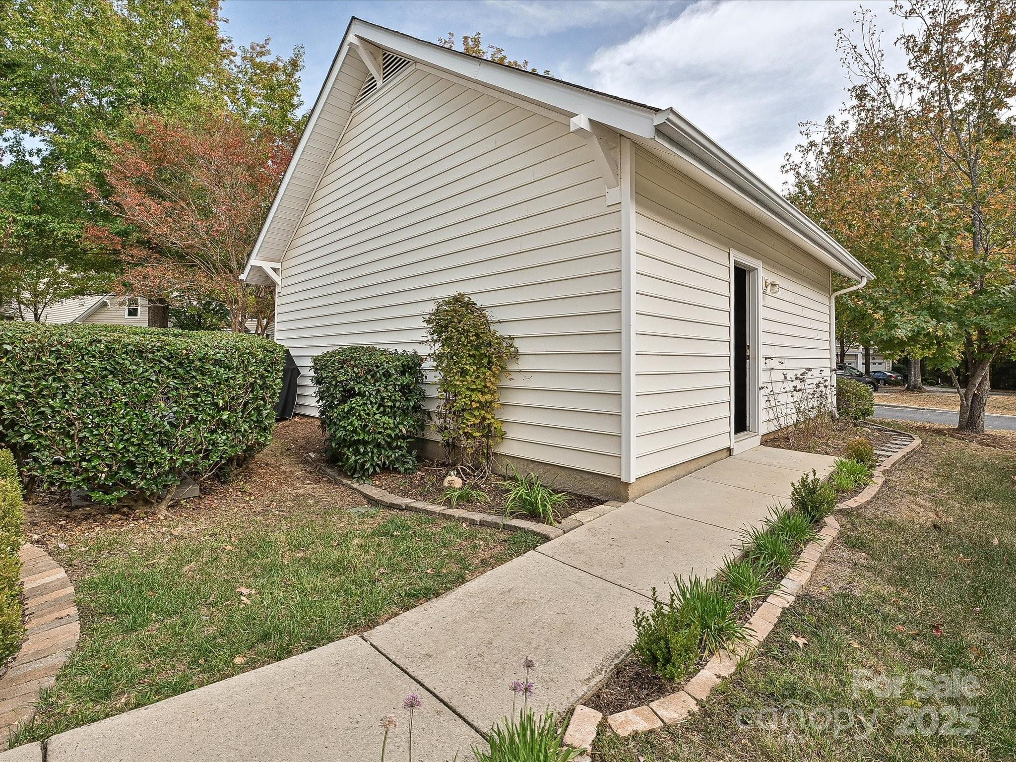 1115 Drummond Lane Matthews, NC 28104 - Photo 22 of 24 a view of a house with a yard