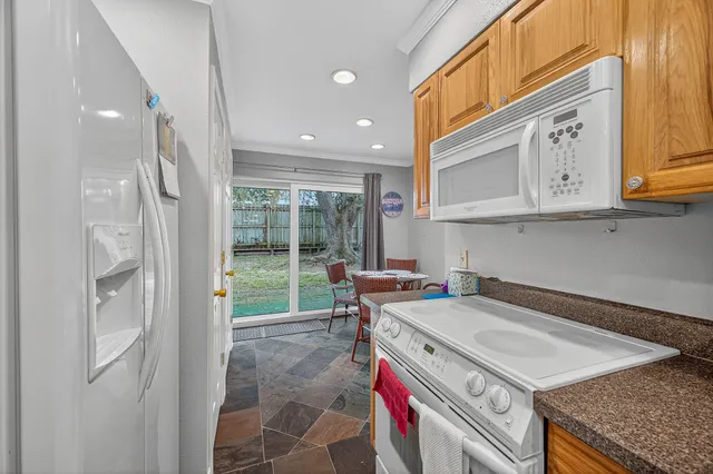 a kitchen that has a stove and a sink