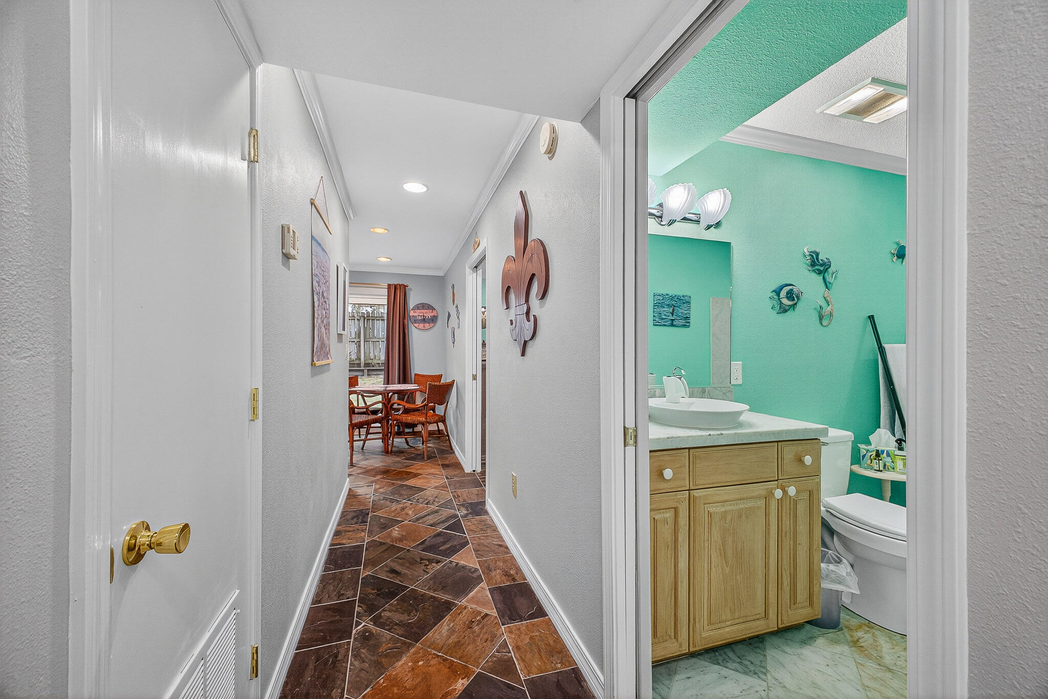 210 Pelham Road, Unit 104B Fort Walton Beach, FL 32547 - Photo 15 of 43 a view of hallway with livingroom and stairs
