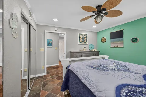 a bedroom with a bed and a view of bathroom