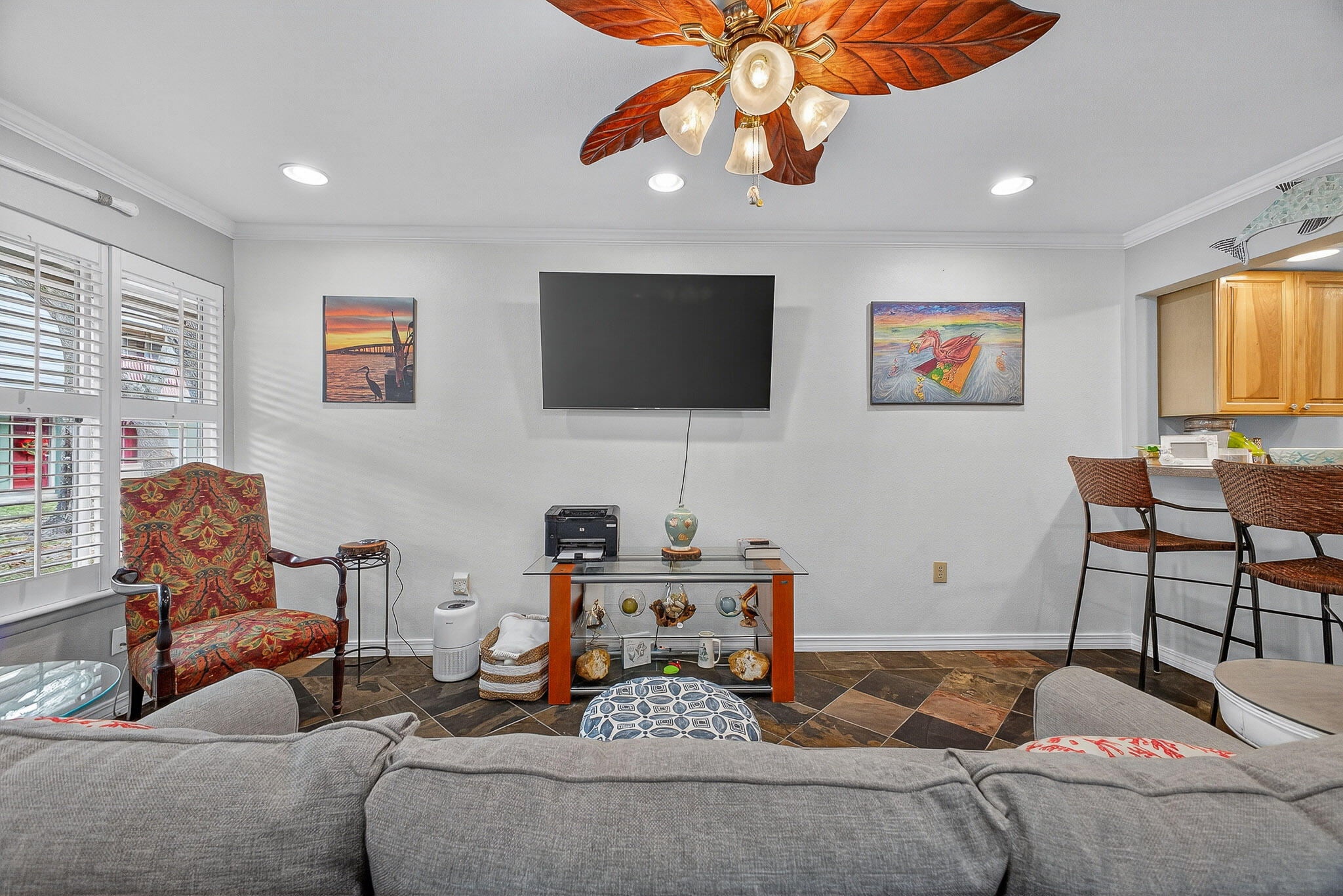 210 Pelham Road, Unit 104B Fort Walton Beach, FL 32547 - Photo 21 of 43 a living room with furniture and a flat screen tv