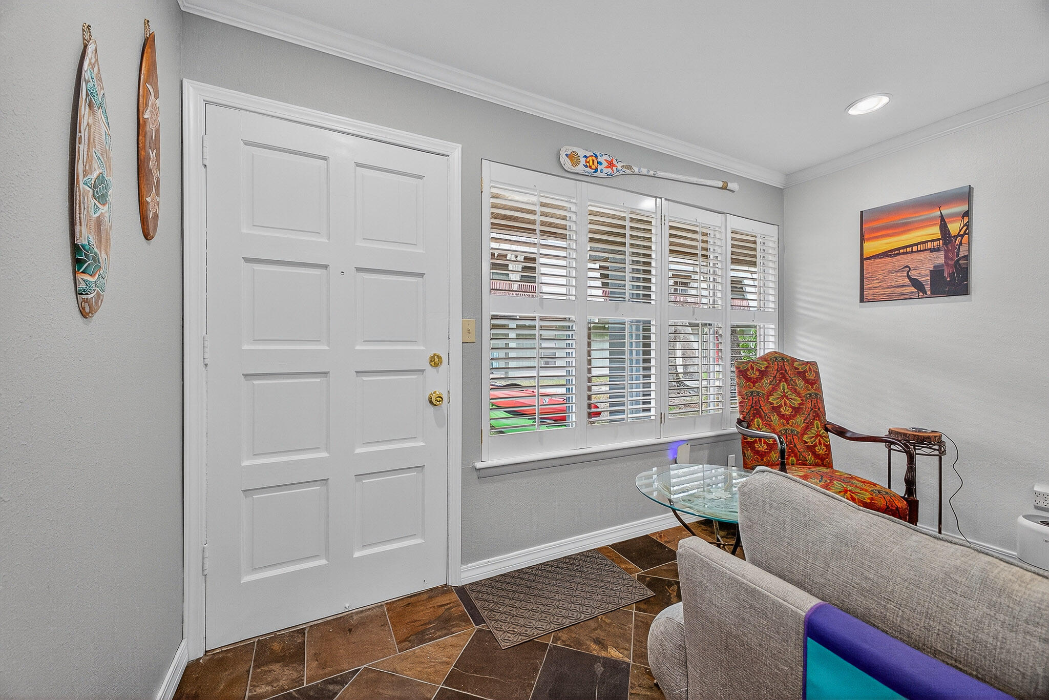 210 Pelham Road, Unit 104B Fort Walton Beach, FL 32547 - Photo 25 of 43 a living room with furniture and a window