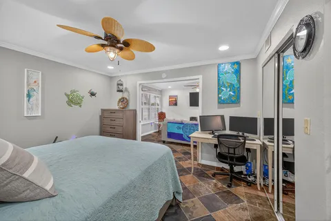 a bedroom with a workspace