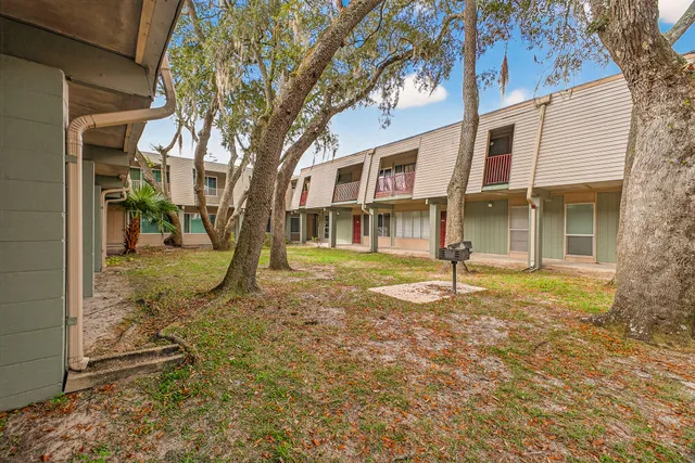 a backyard of a house with lots of green space