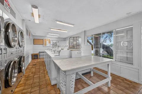 a kitchen with stainless steel appliances granite countertop a stove and a sink