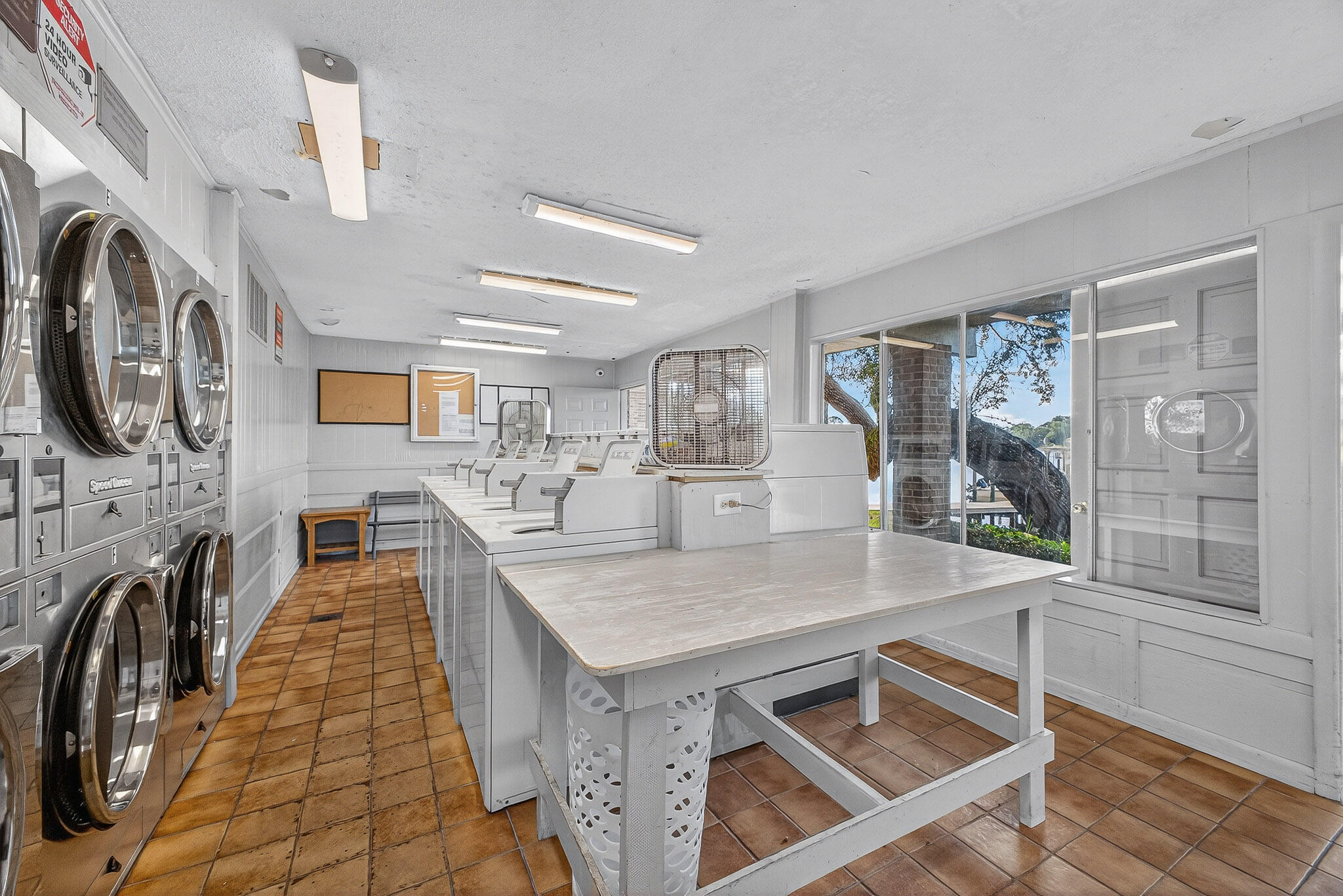 210 Pelham Road, Unit 104B Fort Walton Beach, FL 32547 - Photo 35 of 43 a kitchen with stainless steel appliances granite countertop a stove and a sink