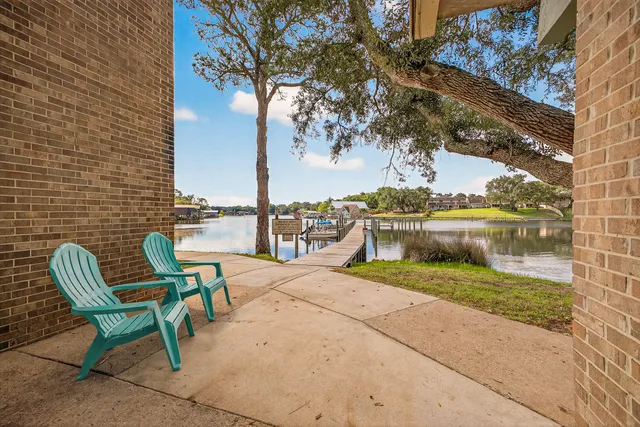 a view of a lake with furniture