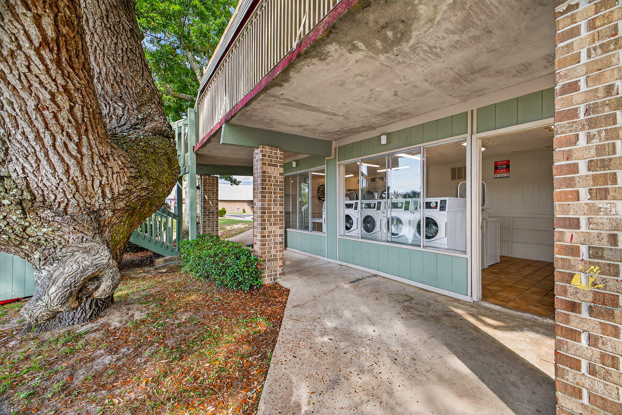 210 Pelham Road, Unit 104B Fort Walton Beach, FL 32547 - Photo 39 of 43 a view of a entrance gate of the house