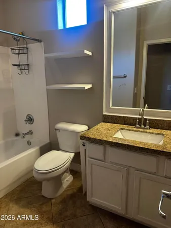 a bathroom with a bathtub and a toilet