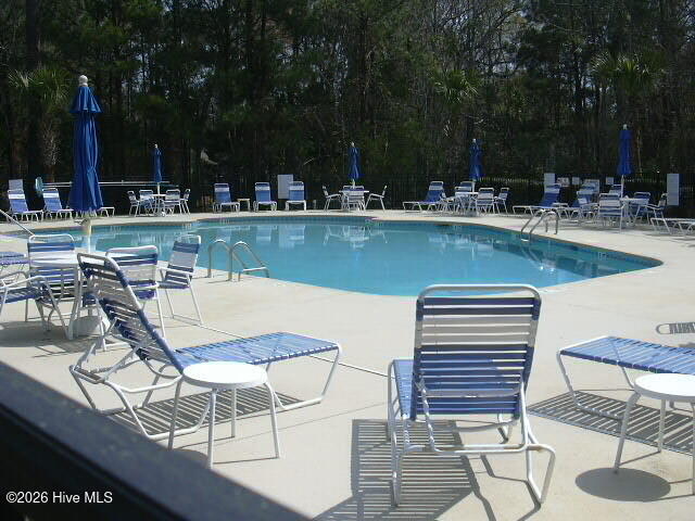 144 Freeboard Lane Calabash, NC 28467 - Photo 24 of 27 Outdoor pool and deck with lounges