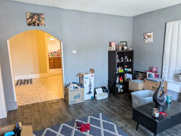 a living room with furniture and toys