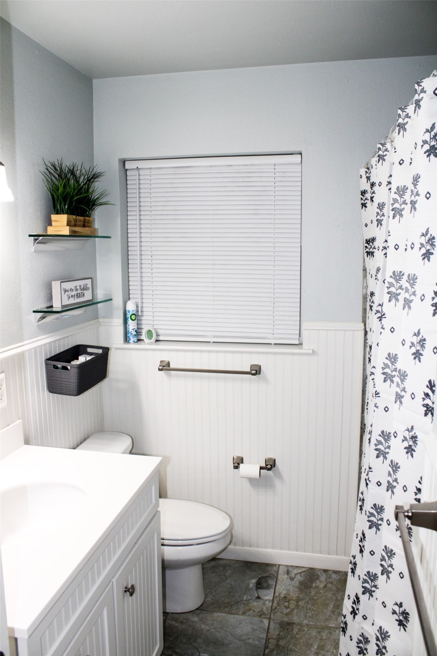 8910 Greiner Drive Houston, TX 77080 - Photo 17 of 21 a bathroom with a sink a toilet and a shower