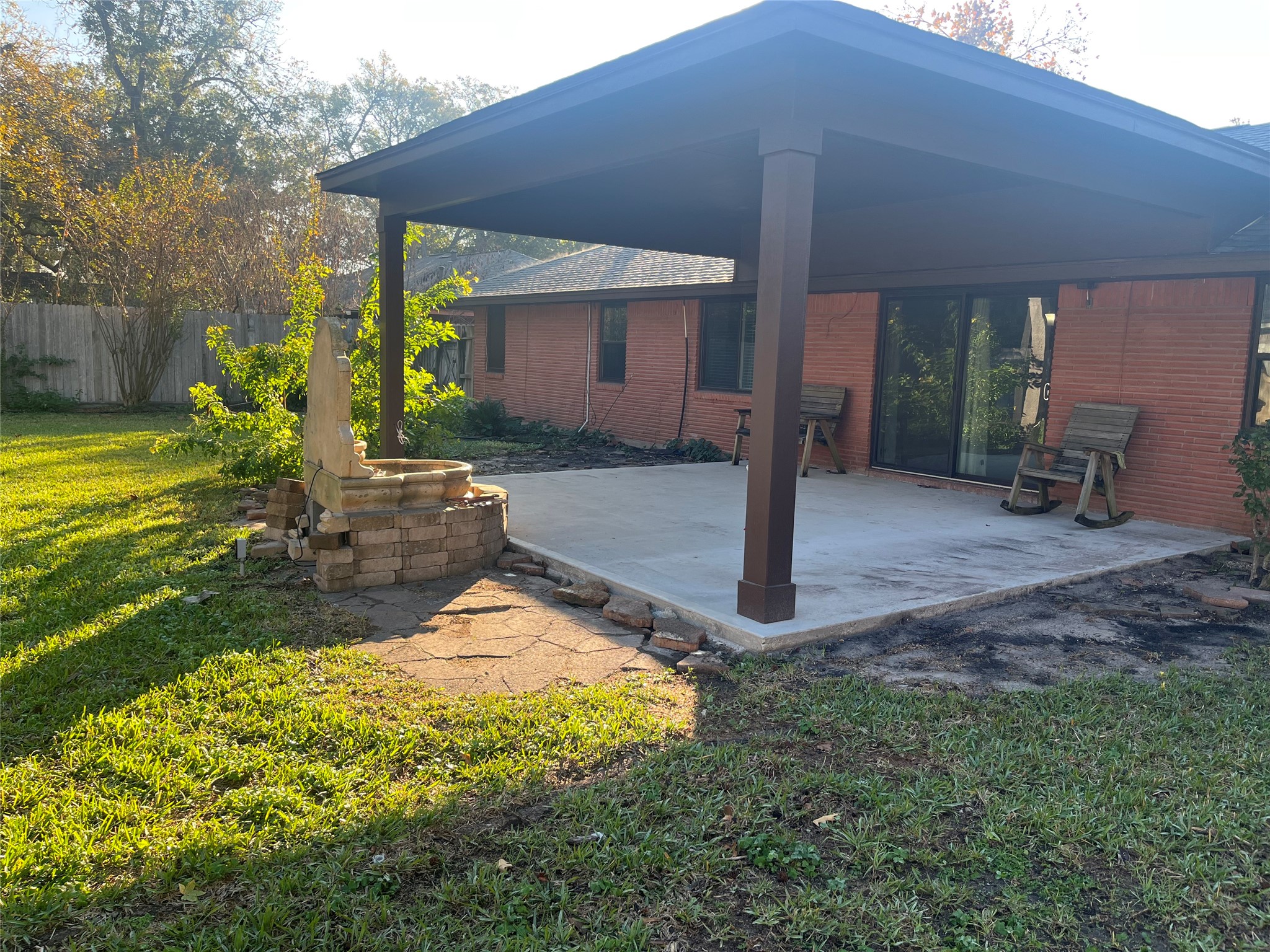 8910 Greiner Drive Houston, TX 77080 - Photo 18 of 21 a backyard of a house with yard table and chairs