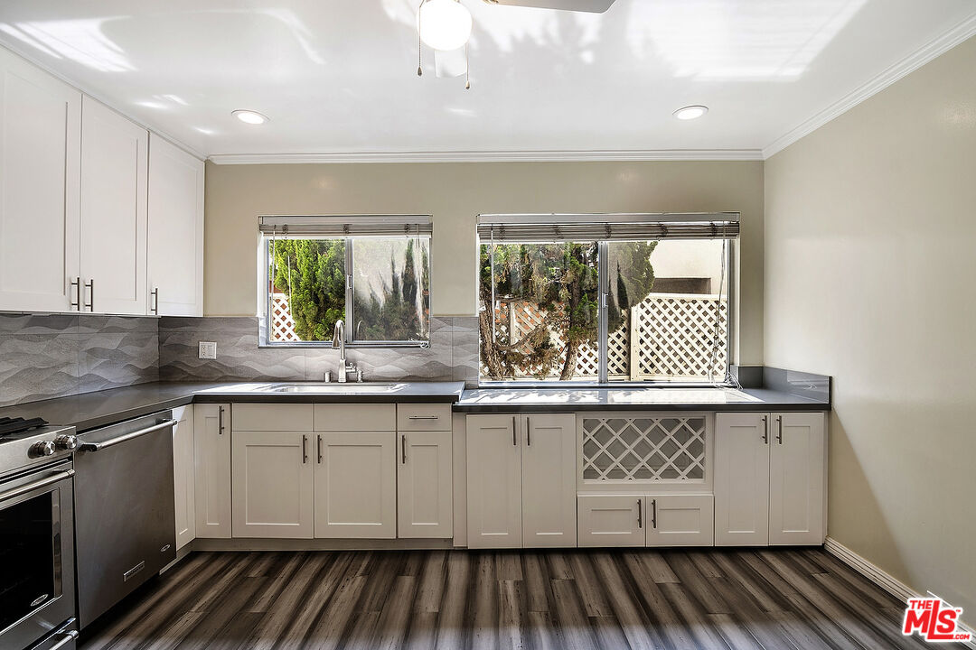 923 17th Street, Unit 3 Santa Monica, CA 90403 - Photo 12 of 22 a kitchen with a sink and cabinets