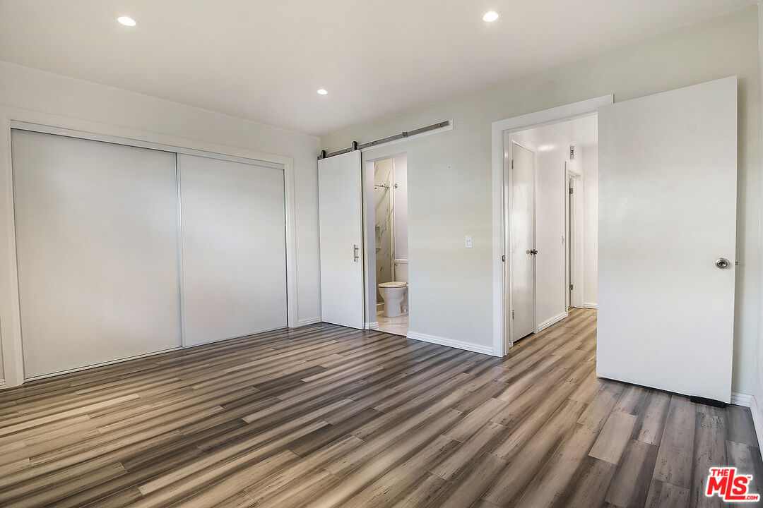 923 17th Street, Unit 3 Santa Monica, CA 90403 - Photo 16 of 22 a view of an empty room with wooden floor