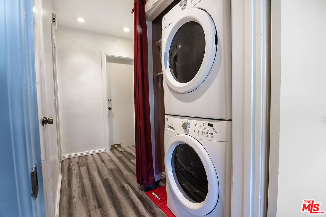 923 17th Street, Unit 3 Santa Monica, CA 90403 - Photo 21 of 22 a view of a hallway with washer and dryer