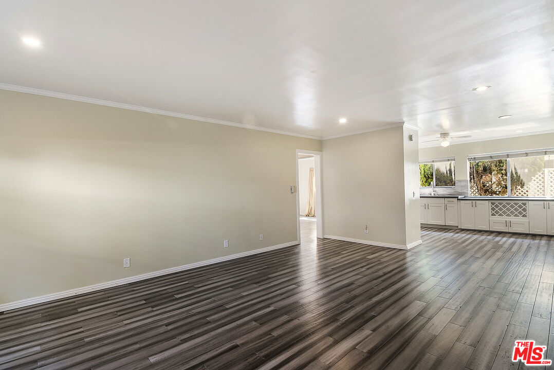 923 17th Street, Unit 3 Santa Monica, CA 90403 - Photo 10 of 22 an empty room with wooden floor and windows