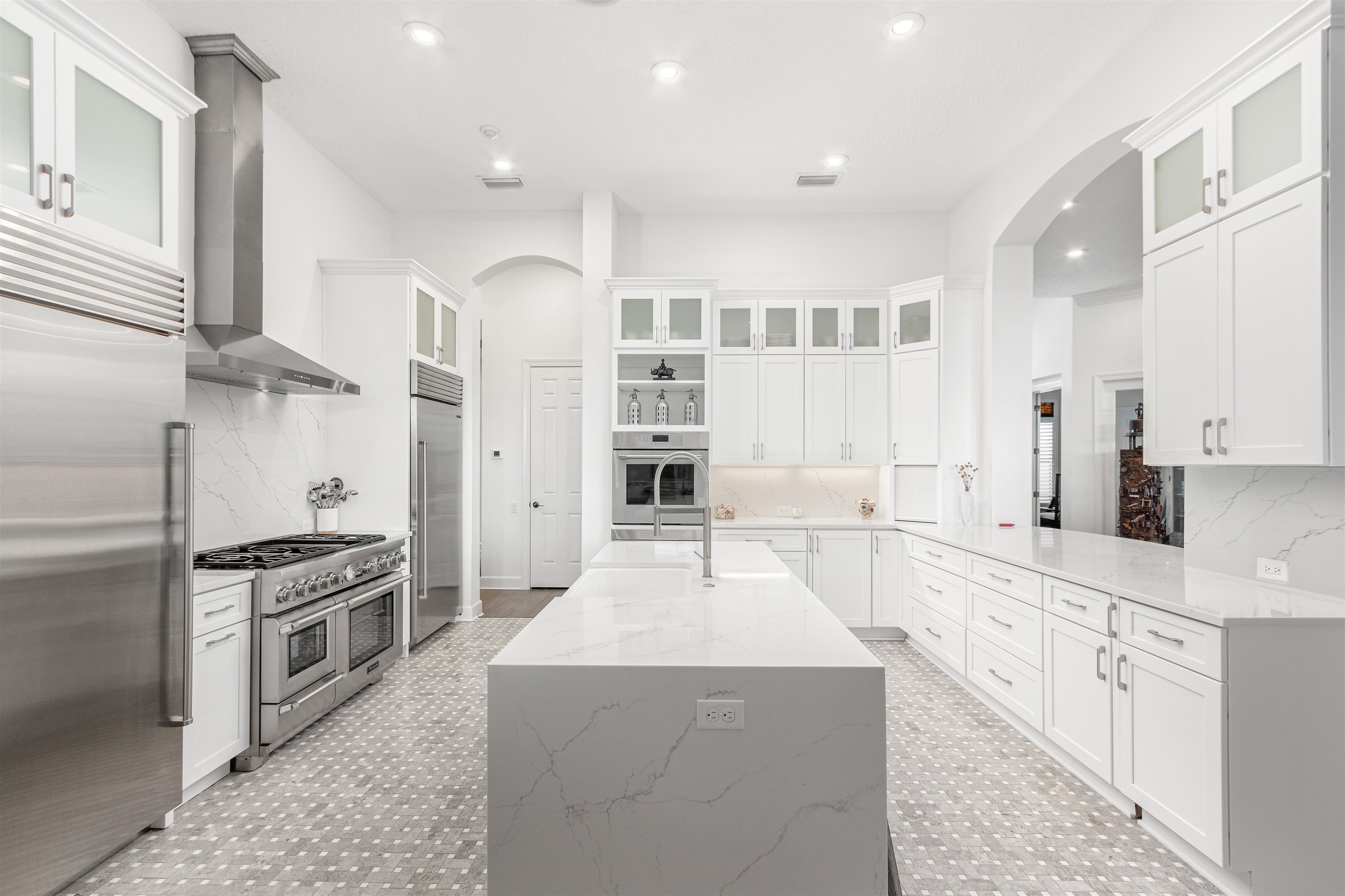 151 Pelican Reef Drive St. Augustine, FL 32080 - Photo 11 of 29 a large kitchen with stainless steel appliances kitchen island granite countertop a large counter top stainless steel appliances and cabinets